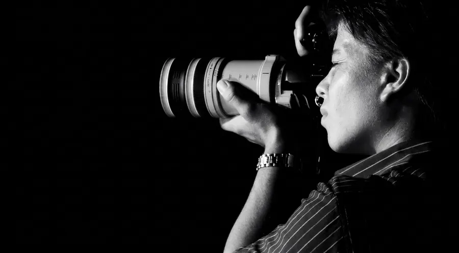 Moises Graniel at work with his camera, portrait in black and white